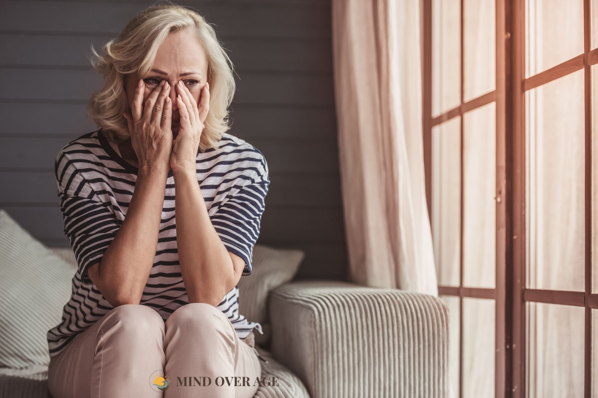 Mind Over Age - Mature woman sad in bed